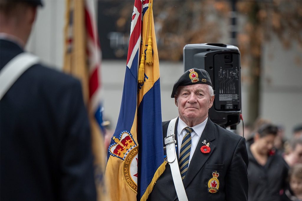 A Legion member holds the Legion flag during the Remembrance Day ceremony in Nanaimo on Nov. 11, 2024.
