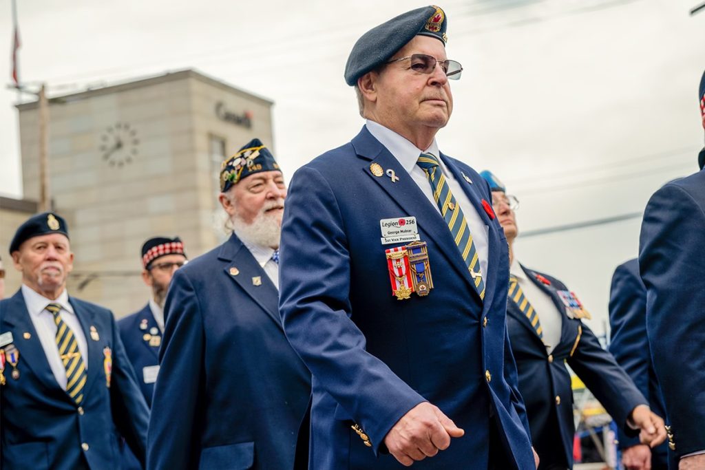 George Molnar, first vice president of Branch 256, marches with Canadian Legion members during the Remembrance Day parade on Nov. 11, 2024.