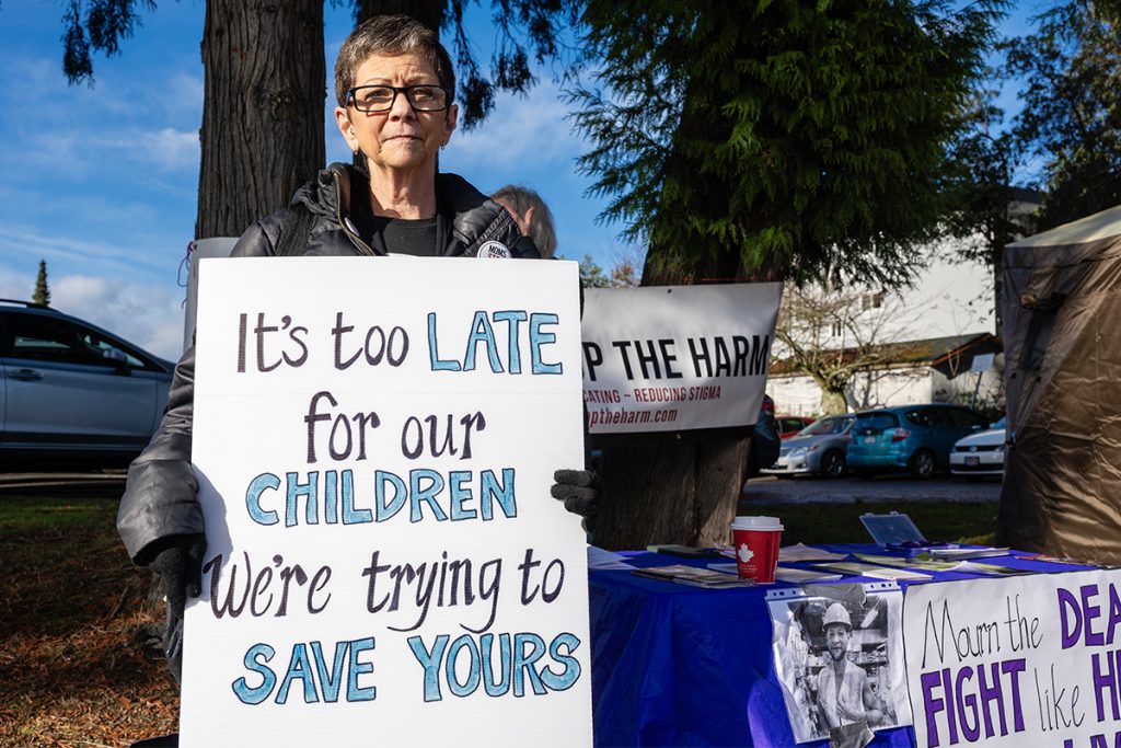 Sue Fichtler lost her son Evan to a fatal overdose in 2022. She was at the opening of a pop-up overdose prevention site across the street from the Nanaimo Regional General Hospital with Moms Stop the Harm on Monday, Nov. 18, 2024 to call for more services for people who use drugs. Photo by Mick Sweetman / The Discourse.