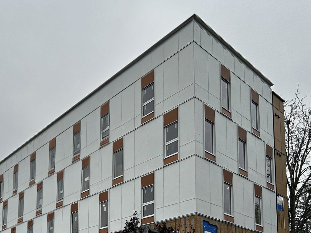 A photo of the 260 White Road Development in Duncan. The building has white and tan pannels