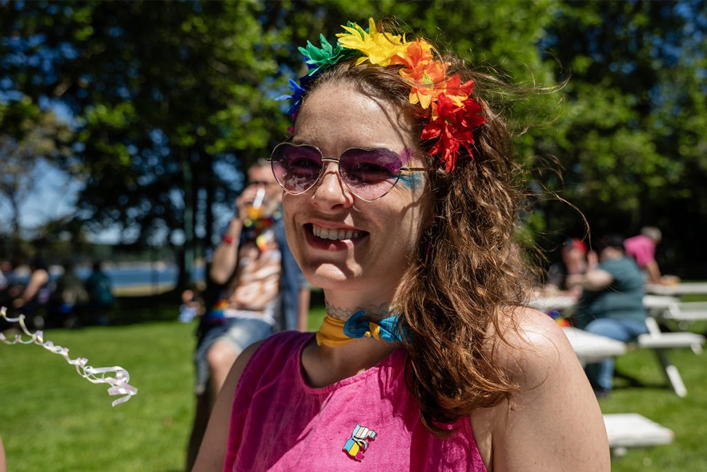 Steph Perry, dressed in an outfit with the pansexual flag colours enjoys the Nanaimo Pride Festival in Maffeo Sutton Park on June 28, 2025.  