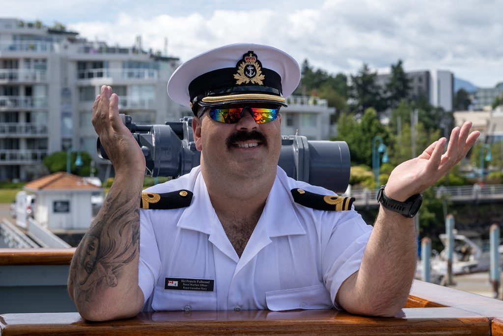 Sub-Lt. Francis Fullwood greets visitors to HMCS Nanaimo during its final visit to its namesake city.