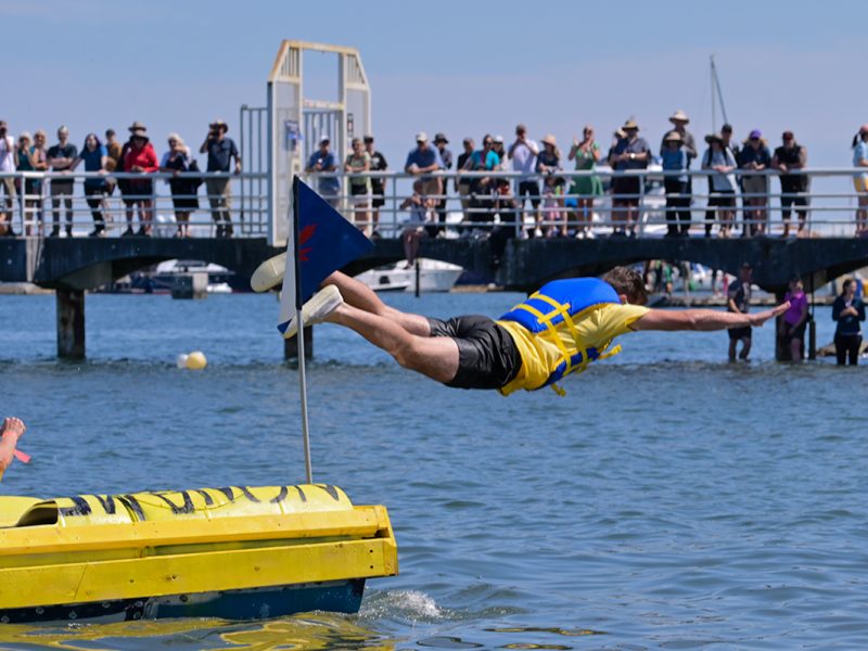 A member of the Superstore team goes for a bellyflop to end their race at the 39th annual Silly Boat Regatta on Sunday, July 20, 2025.