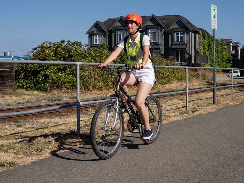 Charlotte Cavalié from the Nanaimo Area Cycling Coalition rides on the multi-use E&N trail.