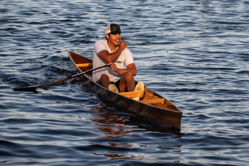 A man smiles at the end of a canoe race at Snuneymuxw Days 2025.