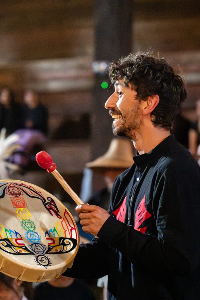 Dominic Fode sings in the longhouse at Snuneymuxw Days 2025 after travelling to the community as part of Tribal Journeys. 