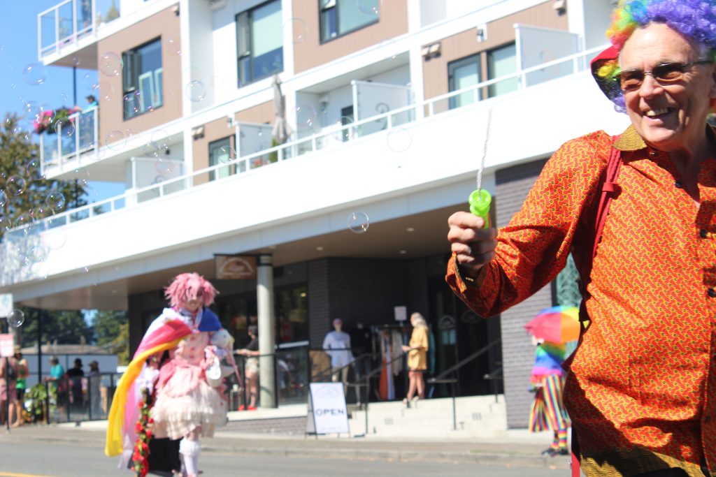 A man blows bubbles during Comox Valley Pride