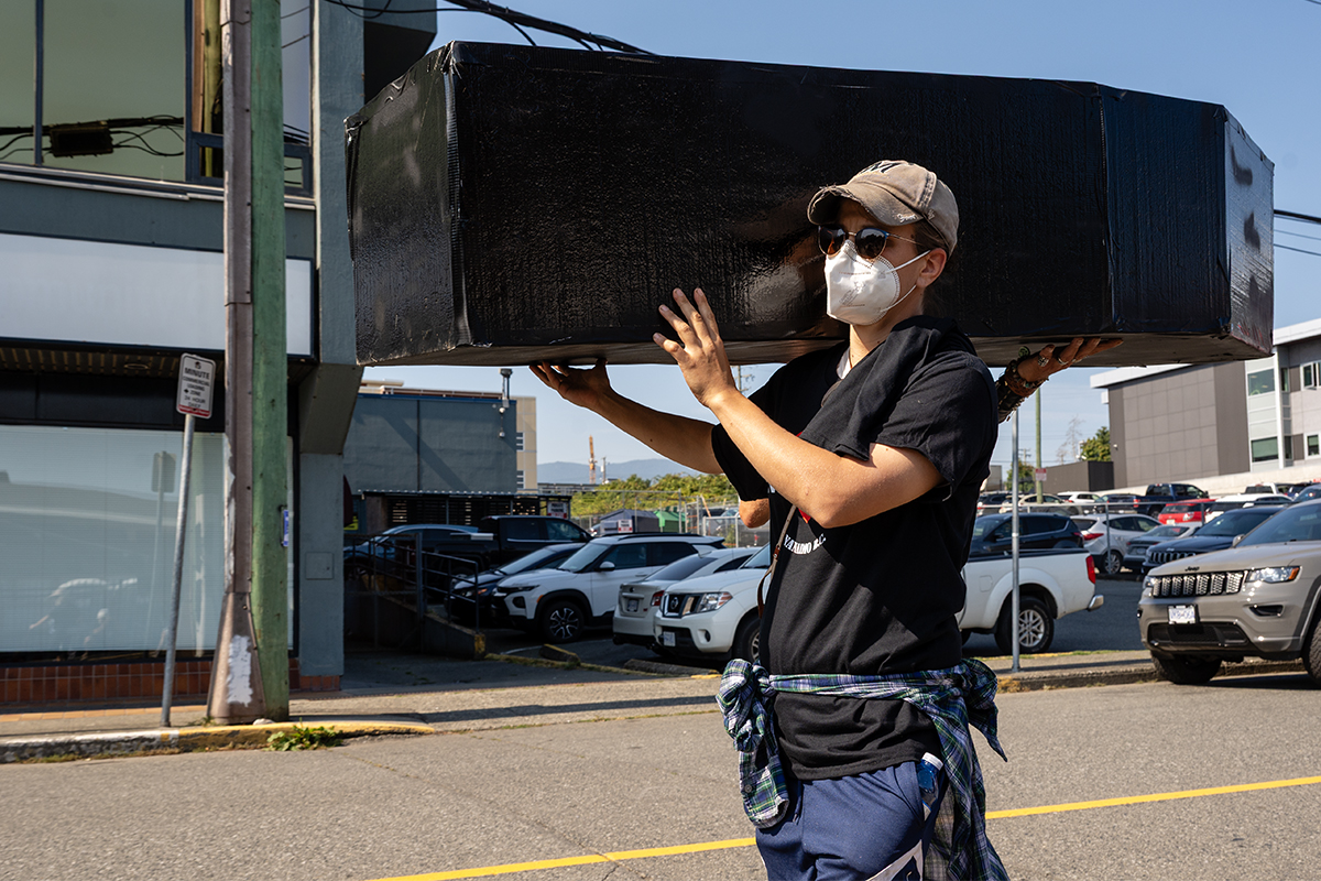 Activists carry a mock coffin at the march for International Overdose Awareness Day in Nanaimo on Aug. 29, 2025. Photo by Mick Sweetman / The Discourse.