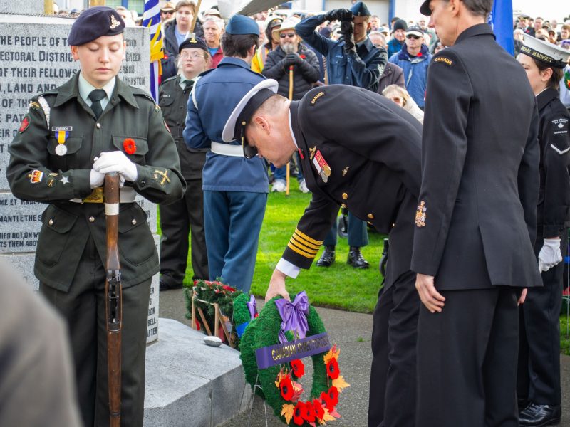 Two people in uniform at a wreath laying ceremony in Duncan for Remembrance Day 2025.