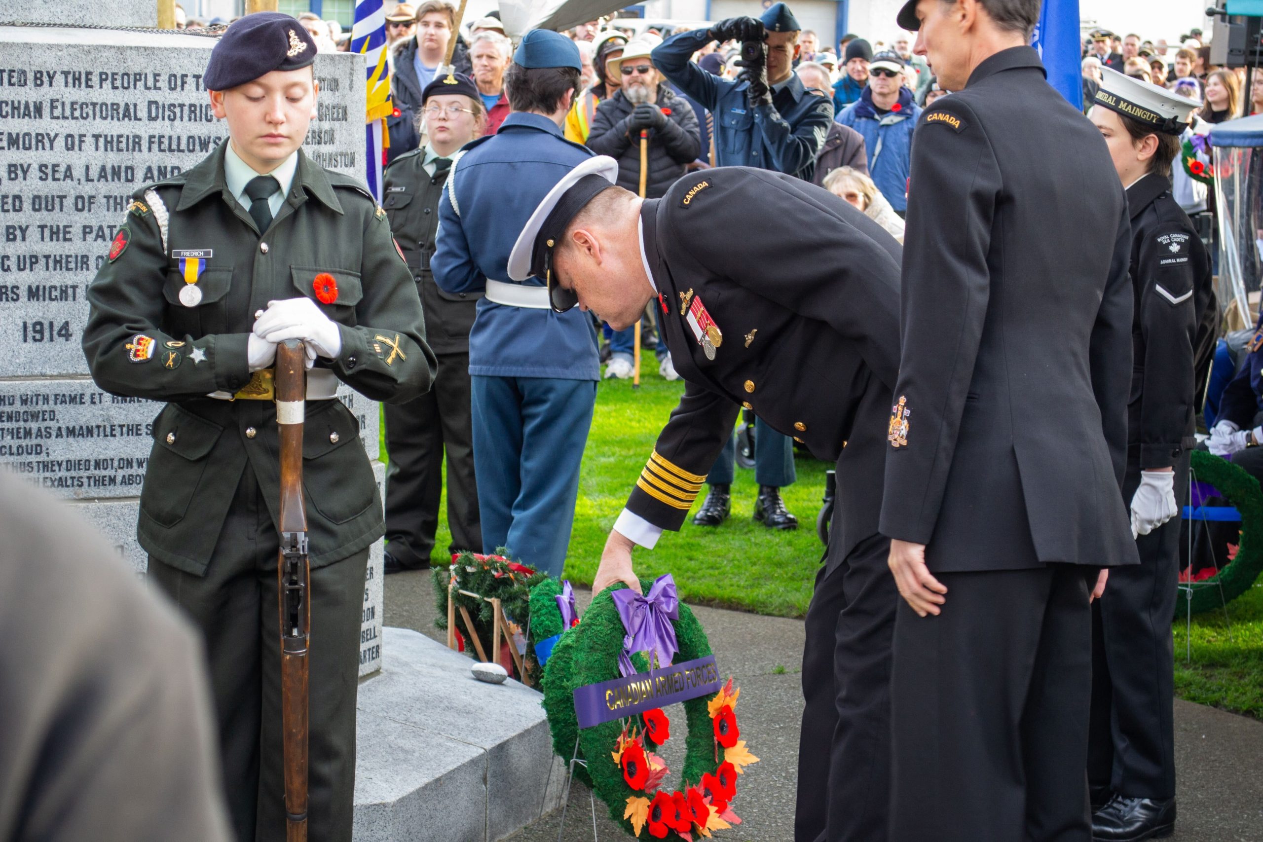 Two people in uniform at a wreath laying ceremony in Duncan for Remembrance Day 2025.