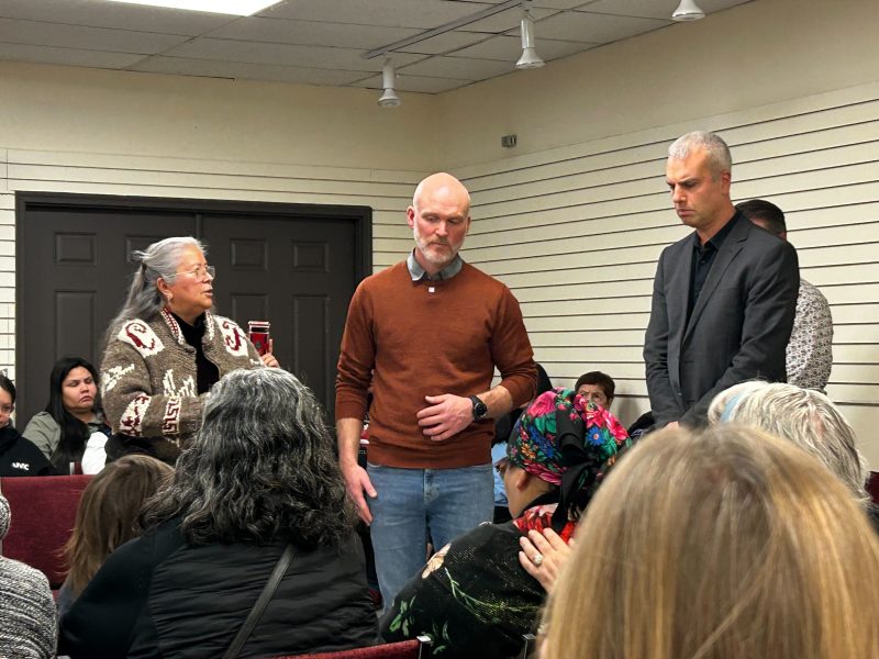 Blackburn (centre) and Peljhan (right) speak to a crowd gathered to remember Lenny Slyvester. They promised that there would be an investigation Sylvester's death.