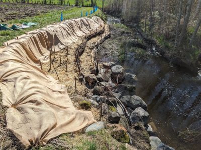 A photo of some streambank restoration work taking place on a farm thanks to LUSH Valley volunteers.