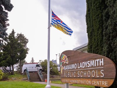 Nanaimo Ladysmith Public Schools lowered flags to half-mast to mourn the victims of a school shooting in Tumbler Ridge, B.C. last week. School officials and parents say they believe local schools are safe and prepared for a wide range of emergencies, but teachers say more can be done. Photo by Mick Sweetman / The Discourse.