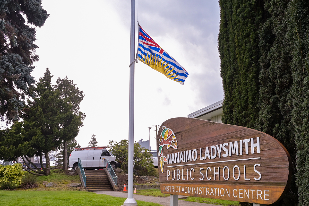 Nanaimo Ladysmith Public Schools lowered flags to half-mast to mourn the victims of a school shooting in Tumbler Ridge, B.C. last week. School officials and parents say they believe local schools are safe and prepared for a wide range of emergencies, but teachers say more can be done. Photo by Mick Sweetman / The Discourse.