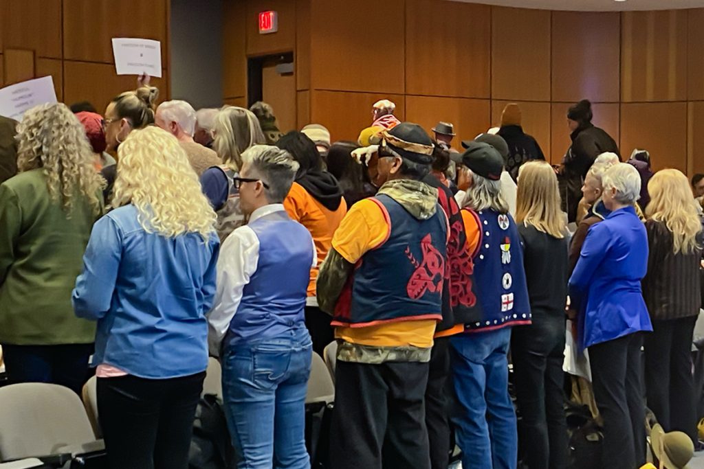 People in the gallery turned their backs on Mayor Leonard Krog at the Nanaimo city council meeting in a silent protest after he said he would not support asking The Port Theatre to review its booking policy in response to outrage comedian Ben Bankas performing there next month. Photo by Mick Sweetman / The Discourse.