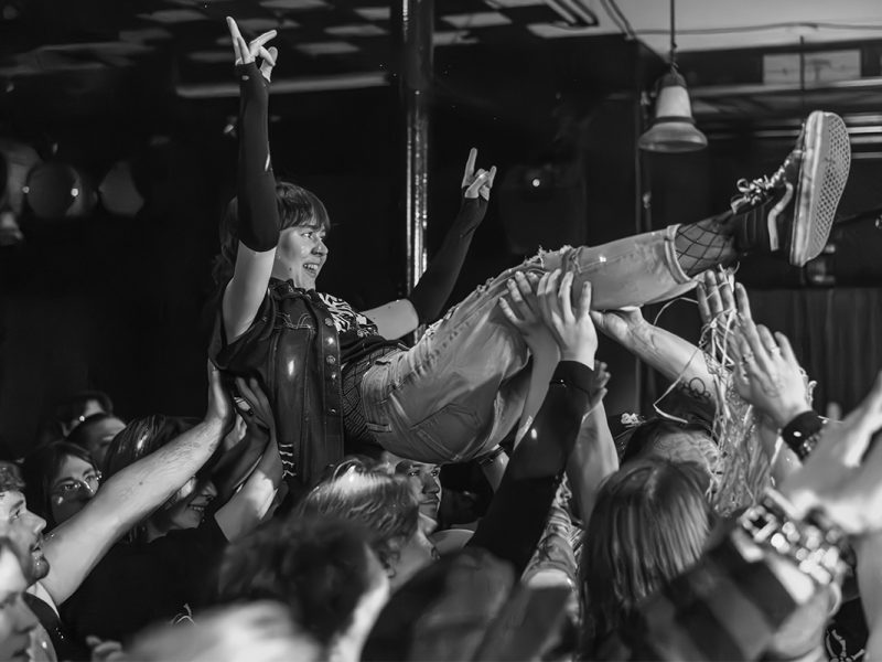 Girl crowdsurfing at a punk show at The Globe Live Studio in Nanaimo