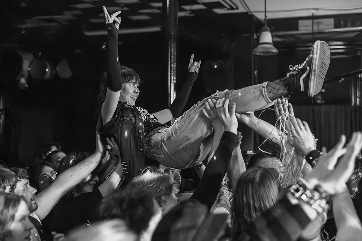 Girl crowdsurfing at a punk show at The Globe Live Studio in Nanaimo