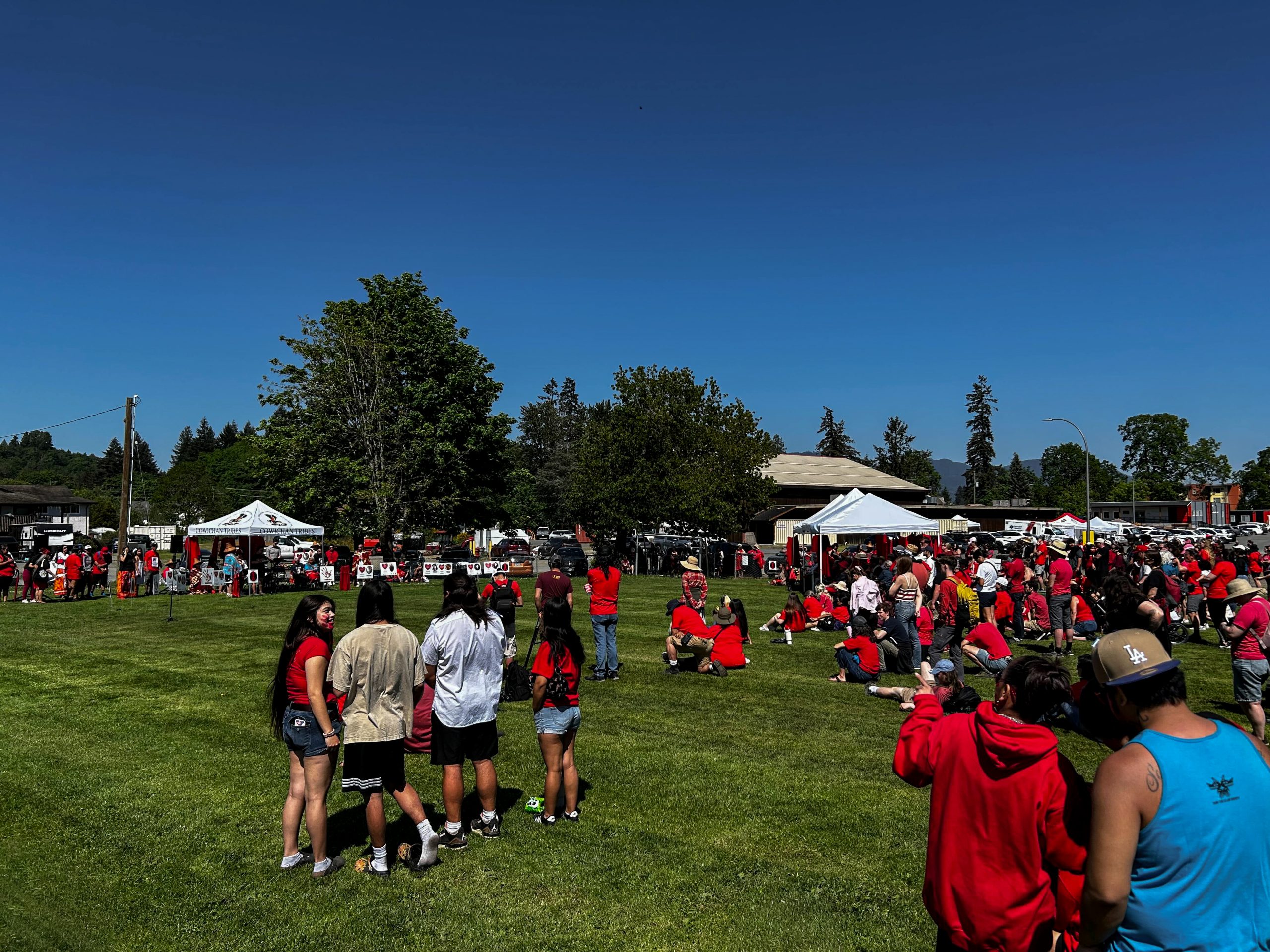 A gathering of people for the opening Gone but Not Forgotten Walk and Run for Red Dress Day in Cowichan Valley.