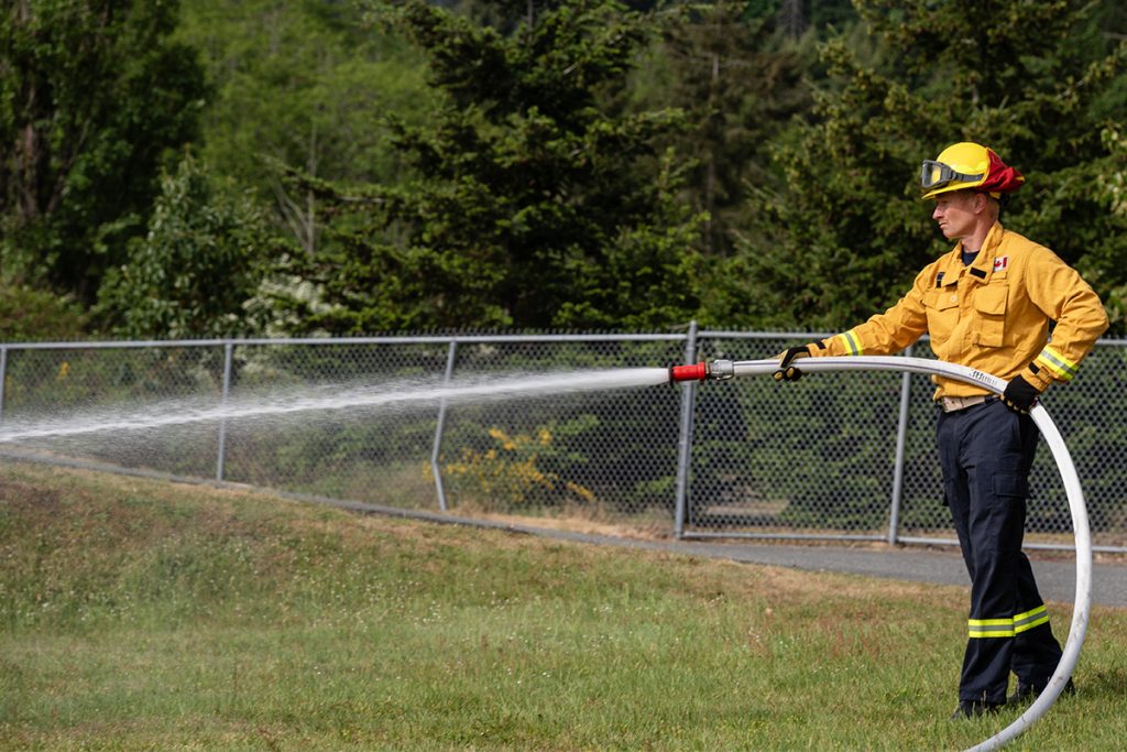 A Nanaimo firefighter participates in a joint wildfire training exercise on May 9, 2026. Photo by Mick Sweetman / The Discourse.