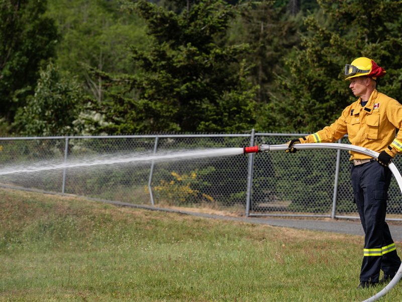 A Nanaimo firefighter participates in a joint wildfire training exercise on May 9, 2026. Photo by Mick Sweetman / The Discourse.