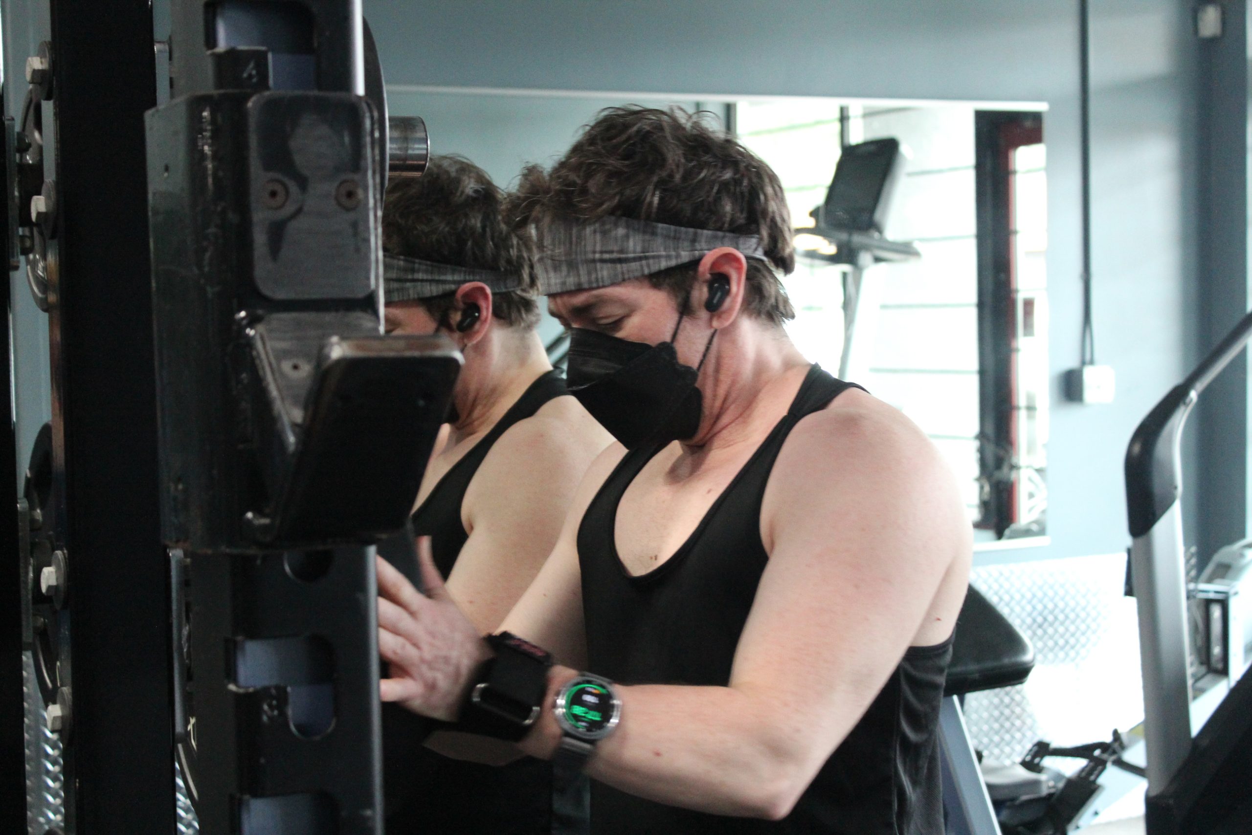 Jules Sherred prepares his weights for bodybuilding training in Duncan BC