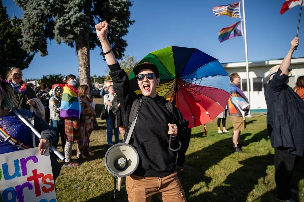 Lauren Semple protests in support of the Sexual Orientation and Gender Identity framework in B.C. schools in front of the Nanaimo—Ladysmith Public Schools building in September 2023.