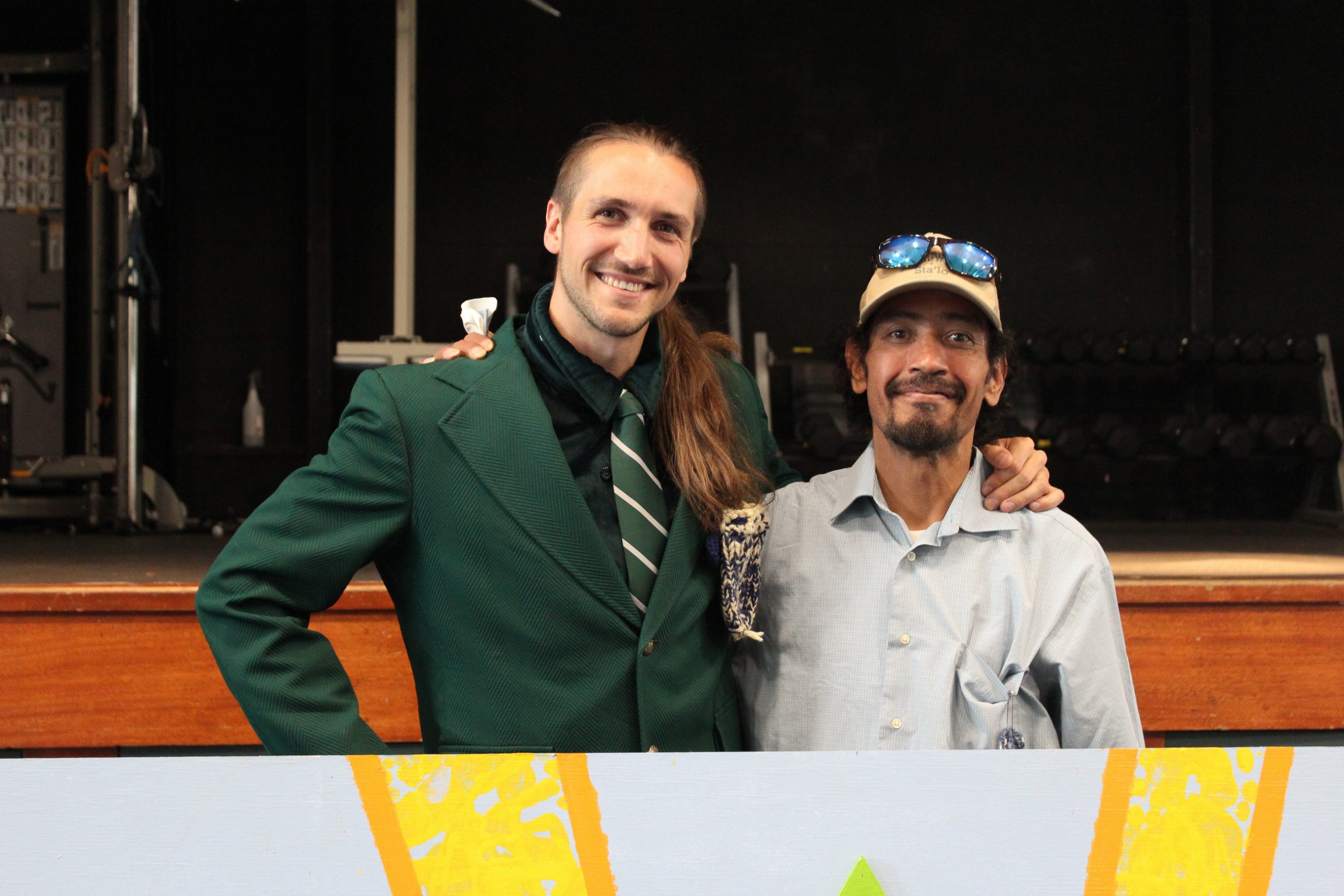 Sailor and Artist Shawn Johnny pose together in front of the new mural.