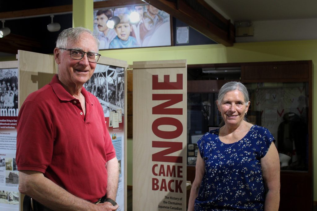 Hiram and Lorraine stand in front of None Came Back.