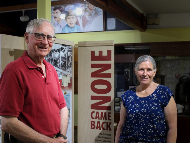 Hiram and Lorraine stand in front of None Came Back.