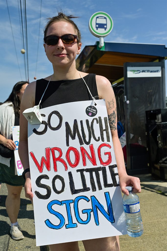 Chloe Emberton, a nurse in the Nanaimo Regional General Hospital’s Intensive Care Unit, walks on a picket line in front of the hospital on Monday, July 13, 2026.