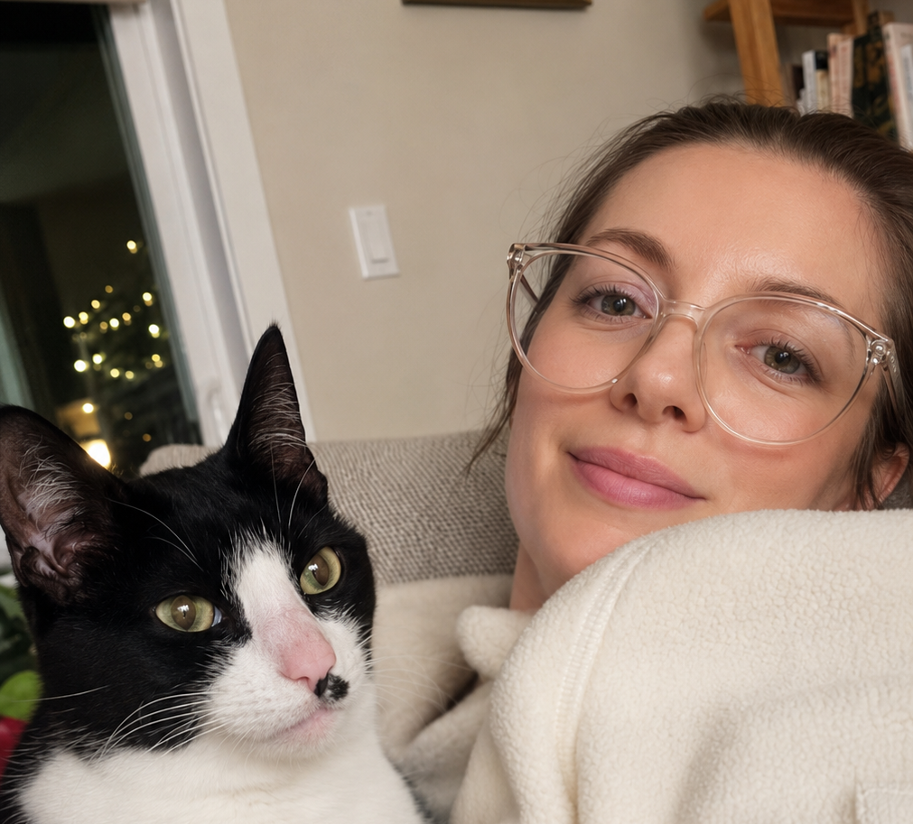 Vivian Albrecht and her foster cat stitch pose for the camera.