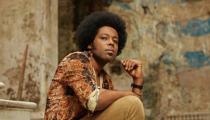 A headshot of Alex Cuba