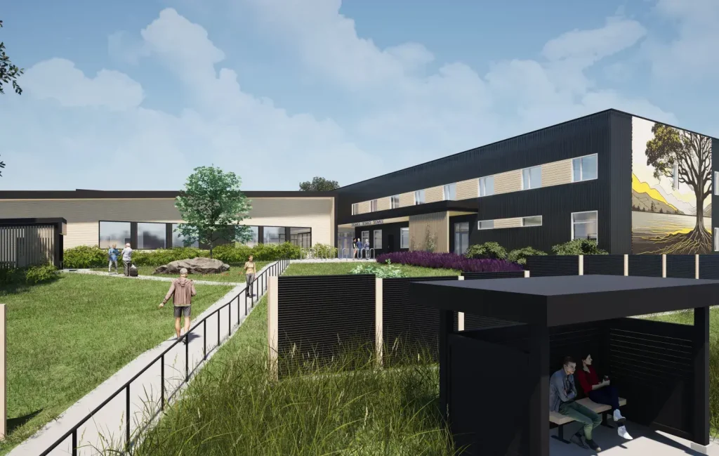 A rendering of a housing complex shows green grass and modern structure
