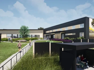 A rendering of a housing complex shows green grass and modern structure